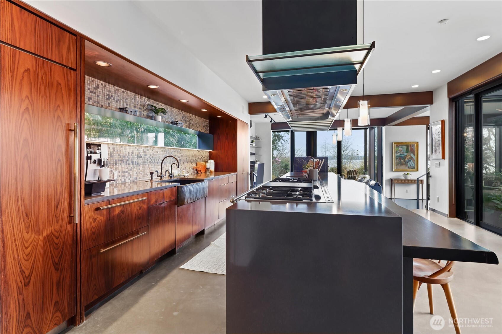 True epicurean kitchen featuring a grand Lacanche Sully 1800 range, multiple ovens, and premium finishes throughout