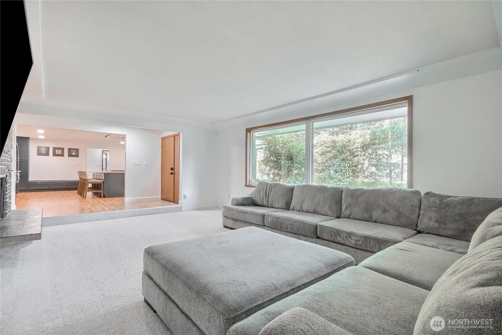Spacious living room opens up to brand-new gourmet chef’s kitchen w/ premium finishes, quartz counters, huge island.