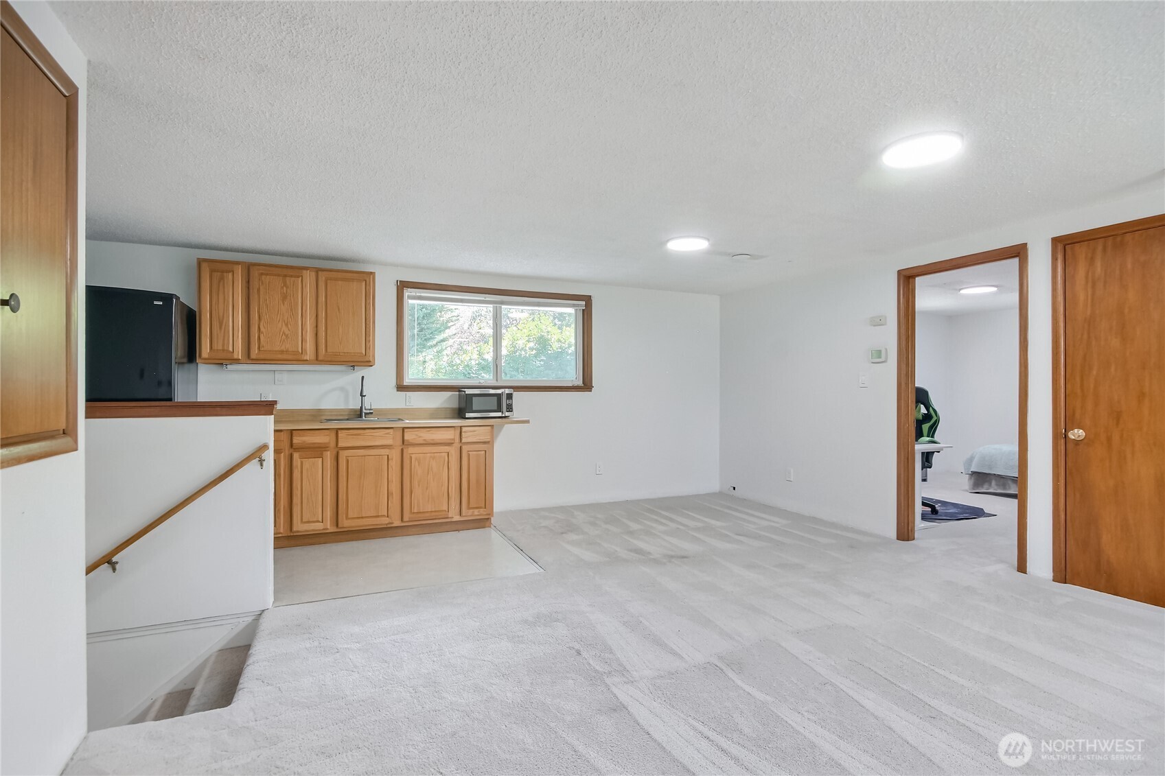 Upstairs private guest quarters w/ 2 bedrooms, great room, micro kitchen & 3/4 bathroom. Virtually Staged.