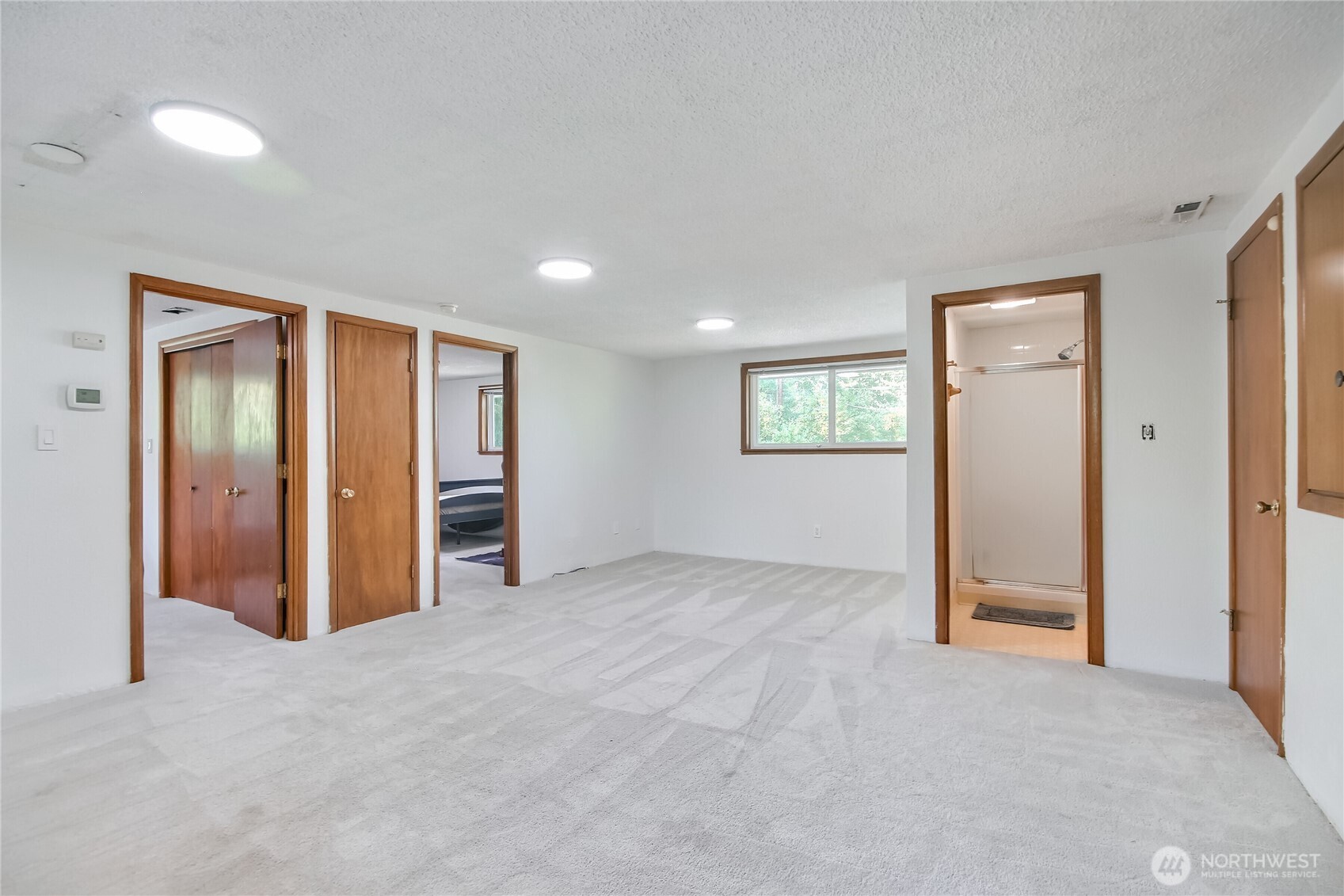 Laundry room with sink and tons of storage.