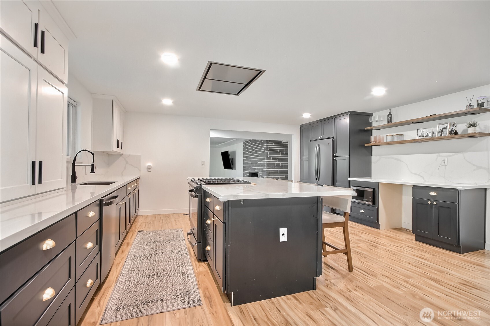 Brand-new gourmet chef’s kitchen w/ premium finishes, quartz counters, huge island & large eat-in space.