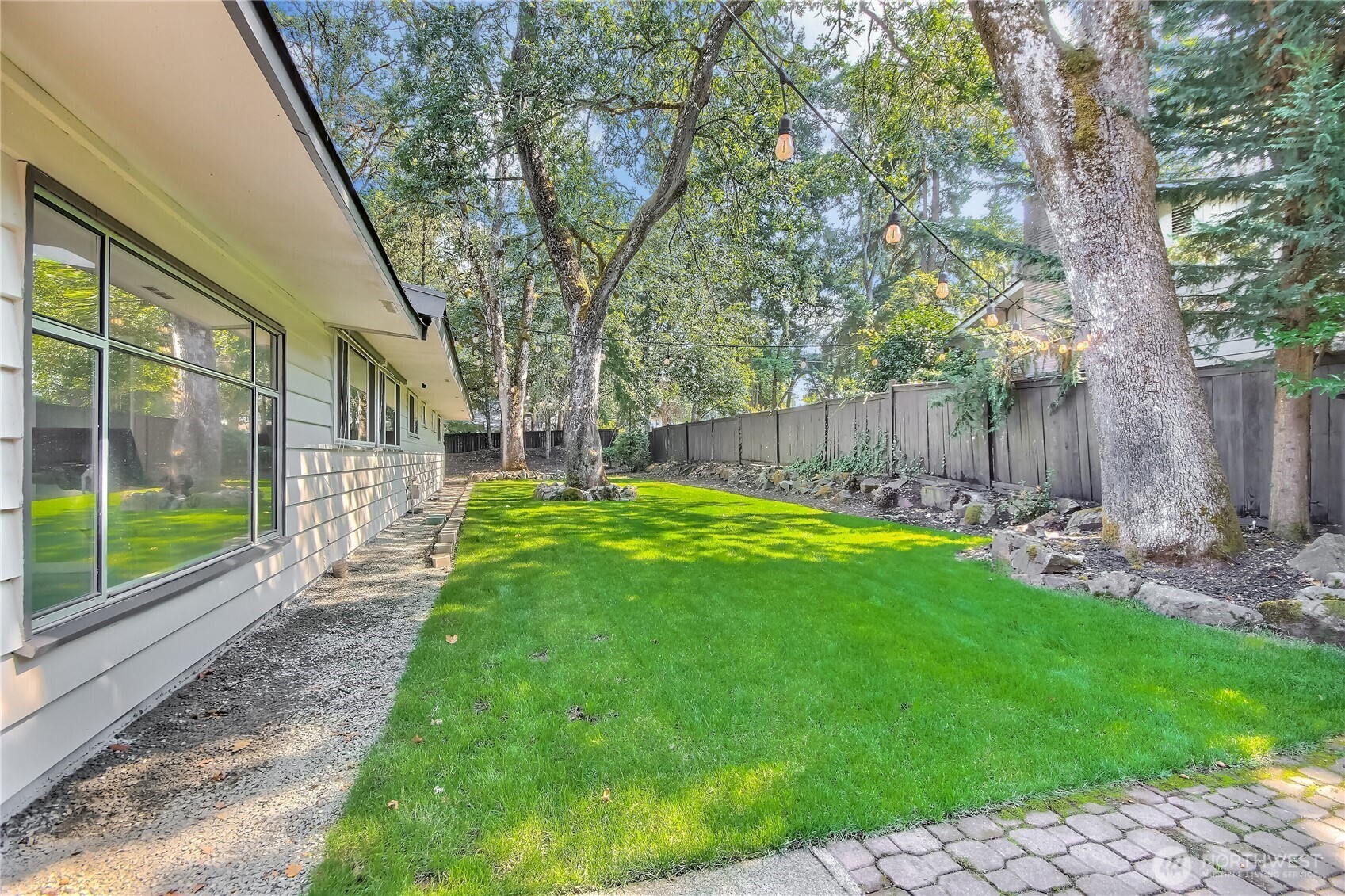 Private backyard that feels like a park perfect for relaxing or entertaining.