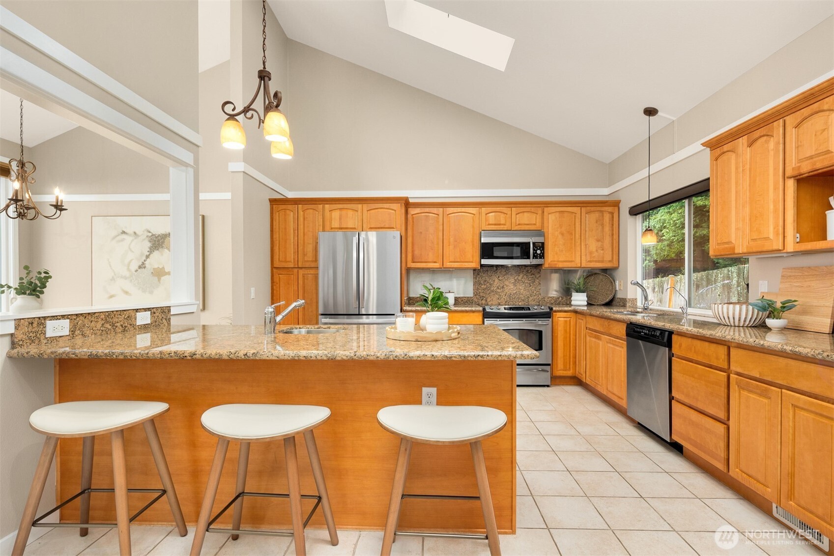 The primary bedroom suite takes in natural light and commanding views.