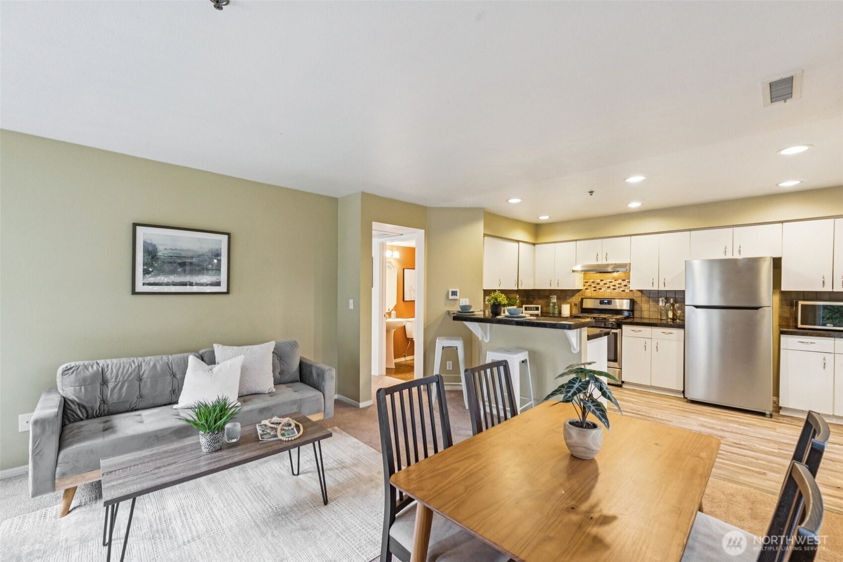 A view of the family room with eating space overlooking at the kitchen.