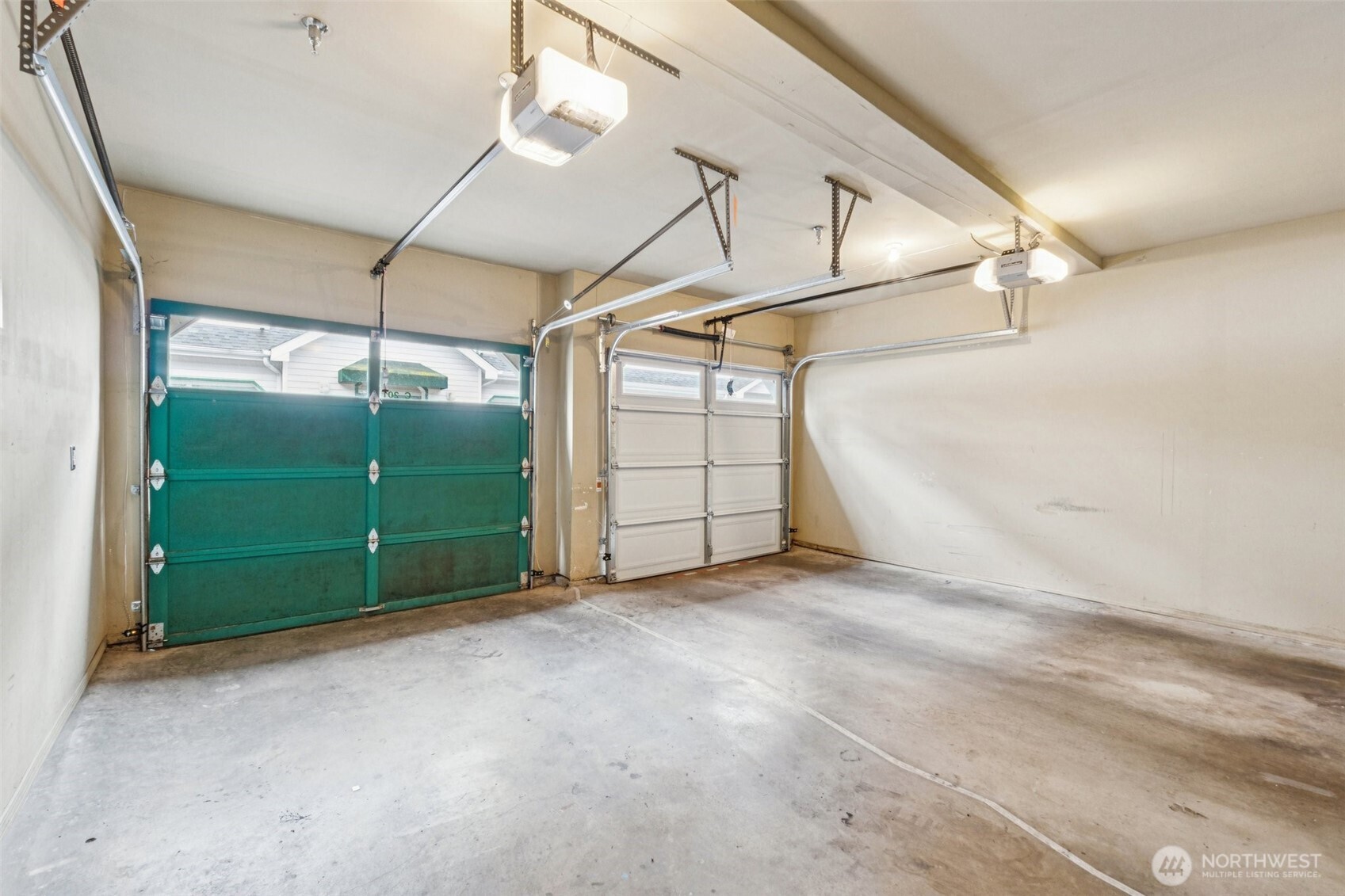 Nice size garage with extra storage area.