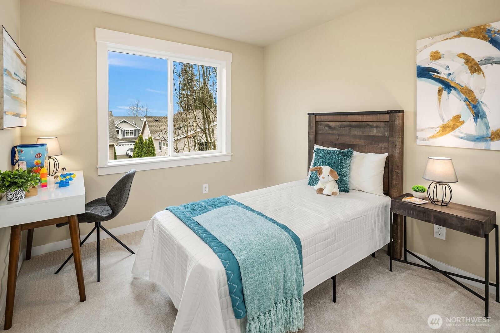 Another well-appointed secondary bedroom features warm carpeting, a bright window with lovely views, and a cozy, versatile layout — a comfortable and inviting space for family or guests.