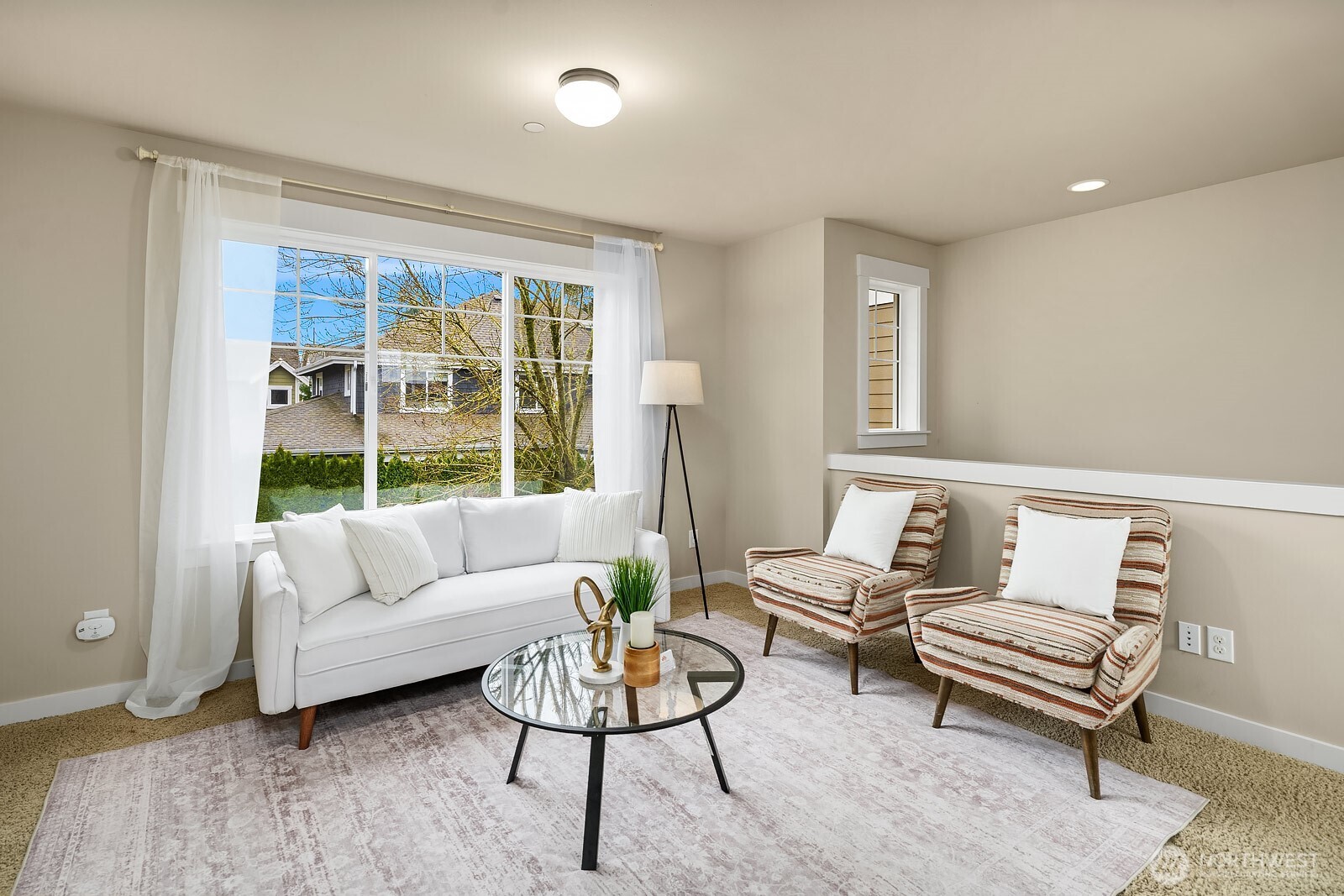 Another view of the ADU's inviting living space highlights the bright, airy feel, neutral finishes, and generous layout — a self-contained and fully permitted retreat that adds exceptional flexibility and value to this already outstanding property.