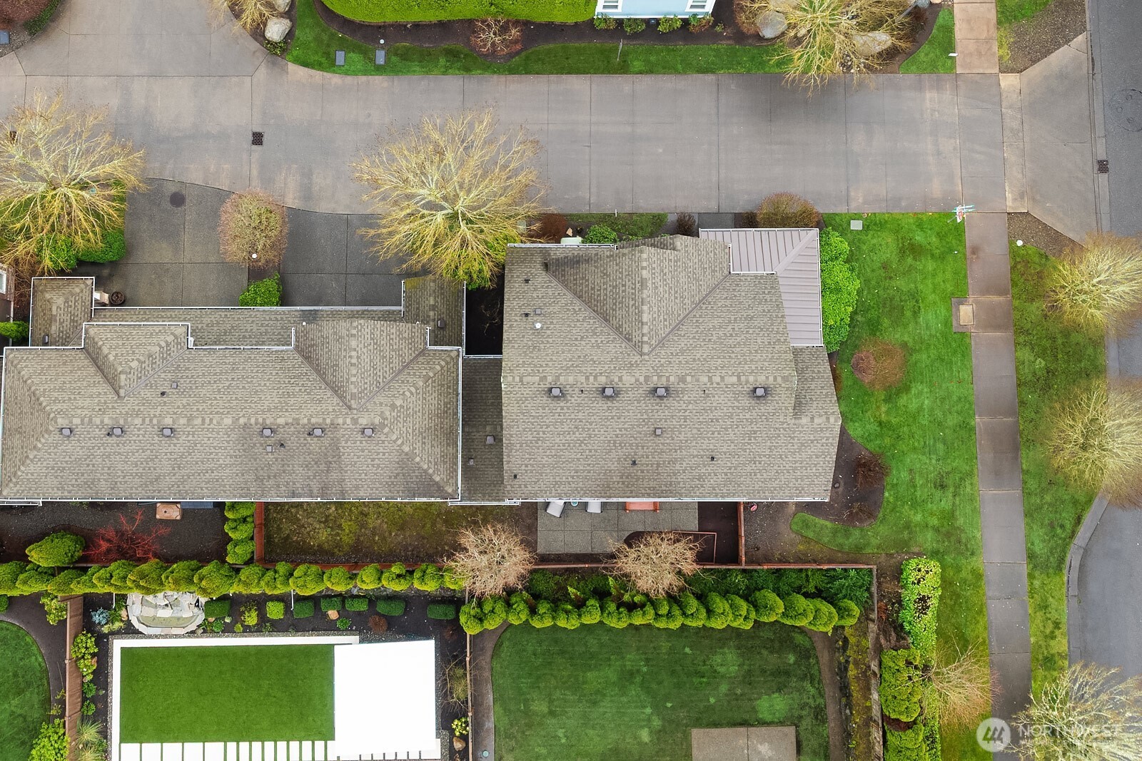 A top-down aerial perspective highlights the generous corner lot, fully fenced yard, private patio, and the home's thoughtful layout — showcasing just how much this exceptional property has to offer inside and out.