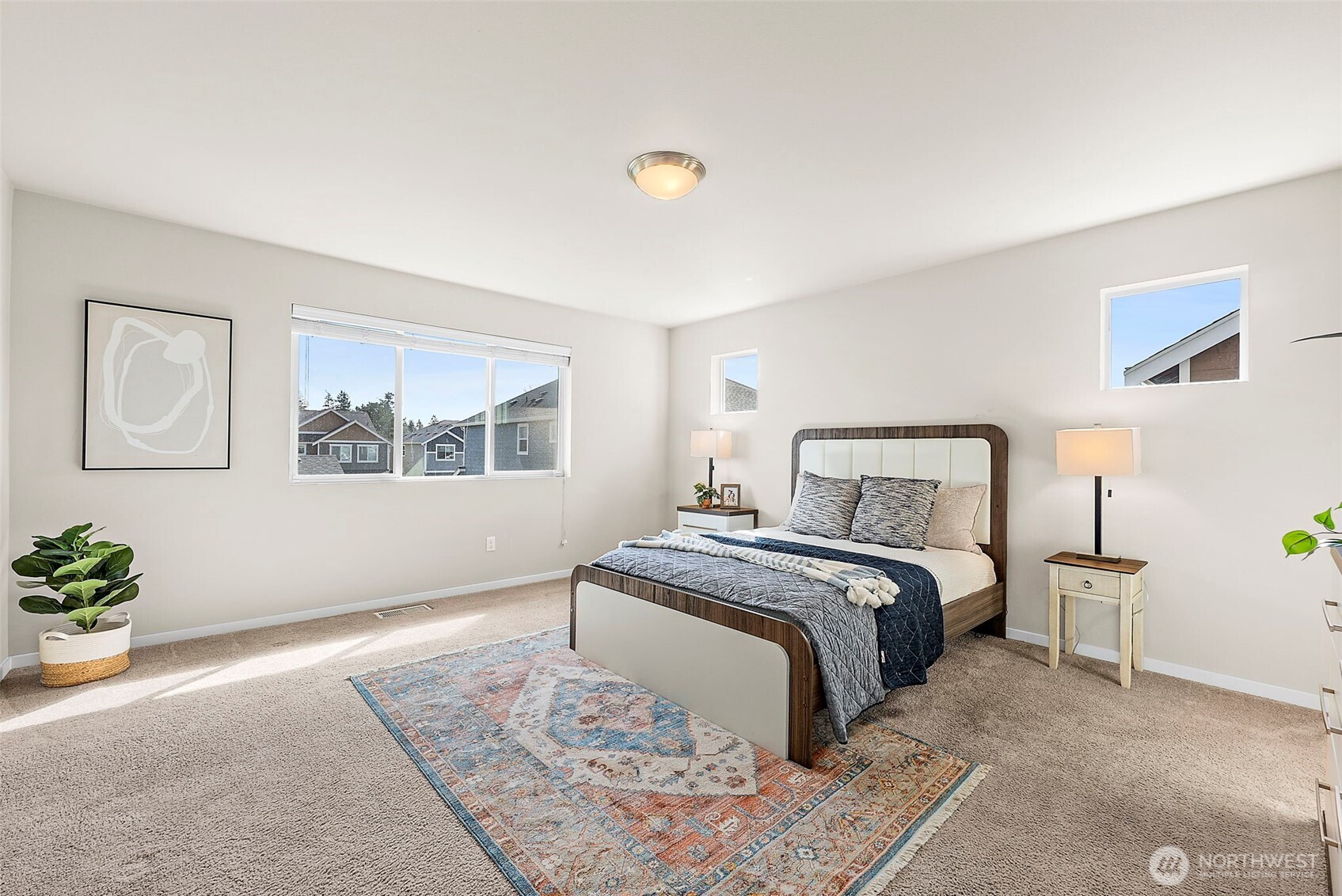 Large primary bedroom. Lots of natural light and space.