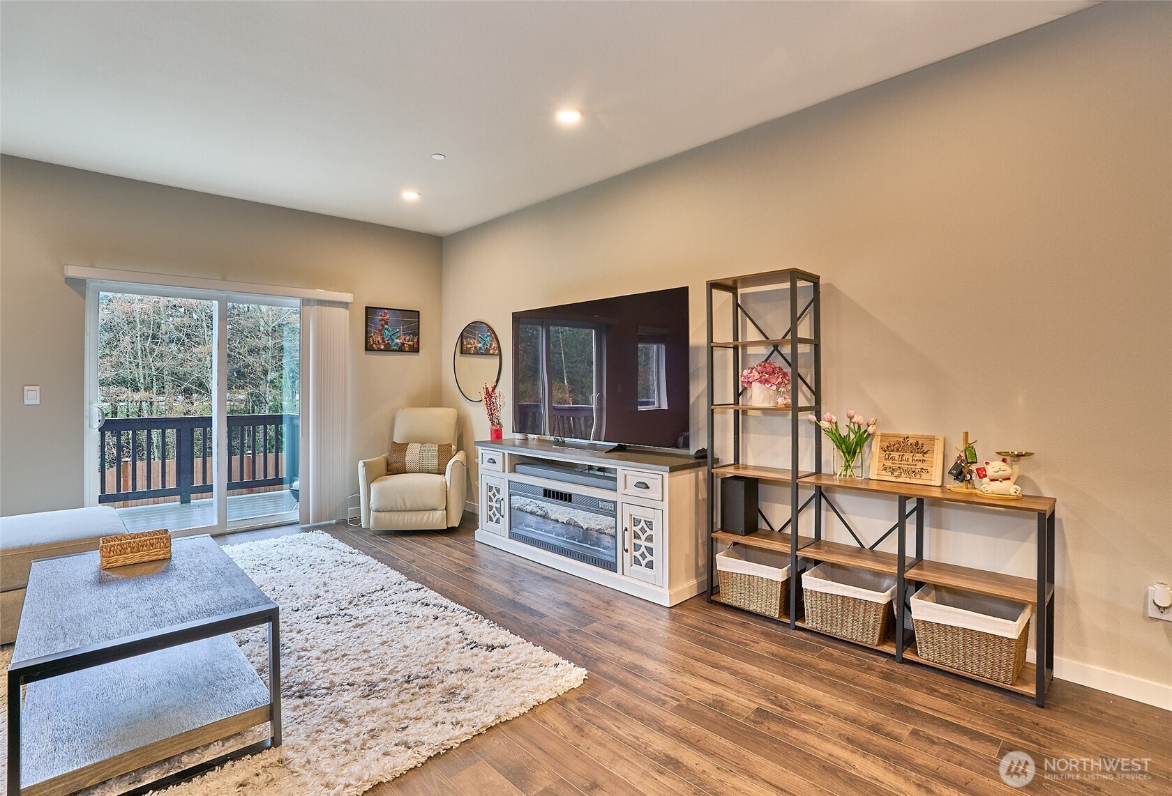 Spacious, living area, door to deck. Lots of natural light.