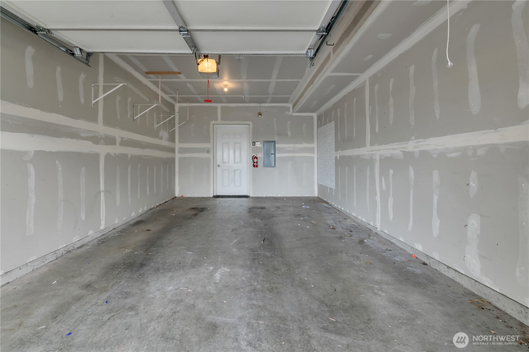 Garage door opener is installed for convenience.