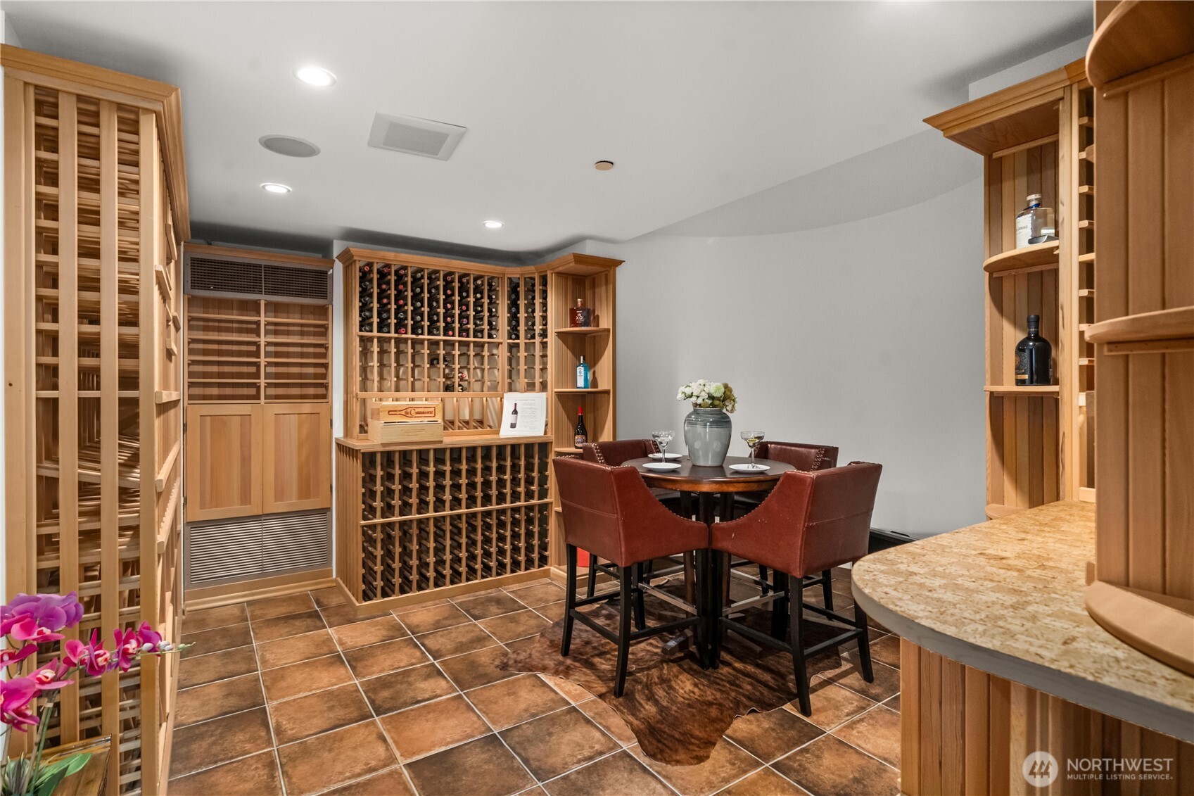A refined wine room designed for collection, display, and intimate tastings.