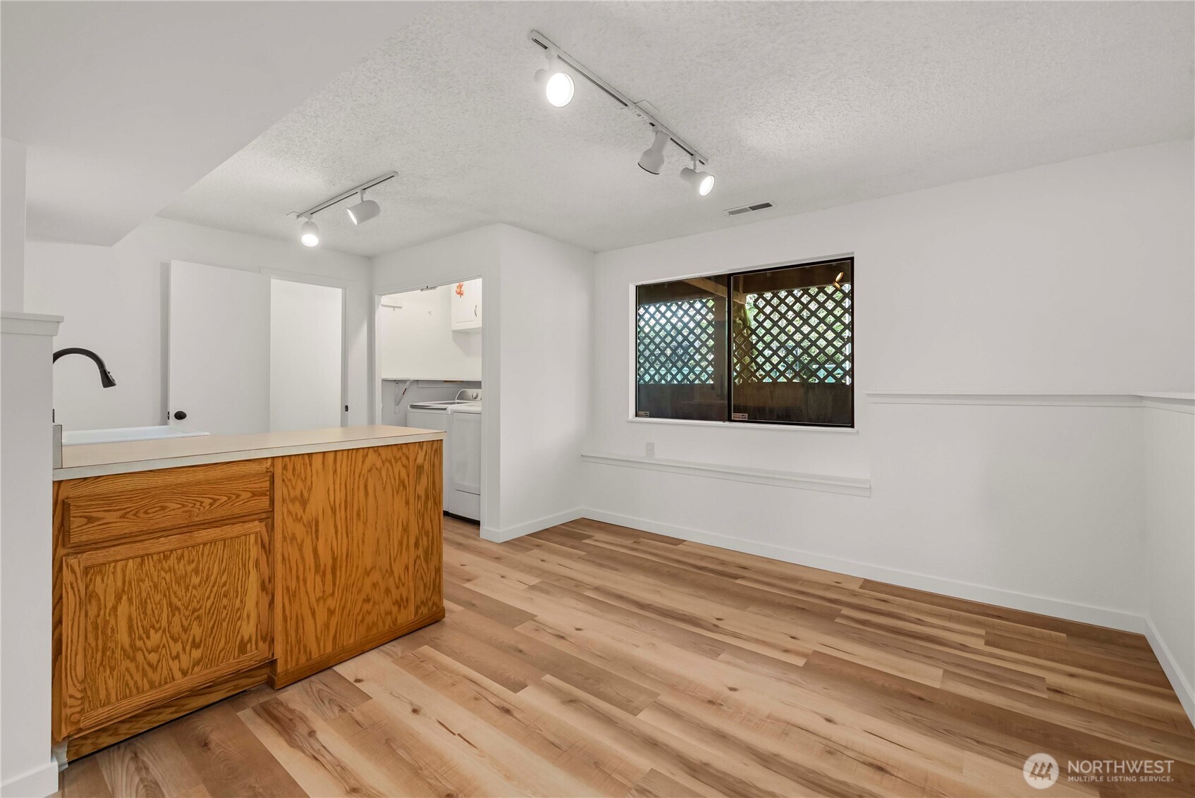 Basement area has sink and cabinet