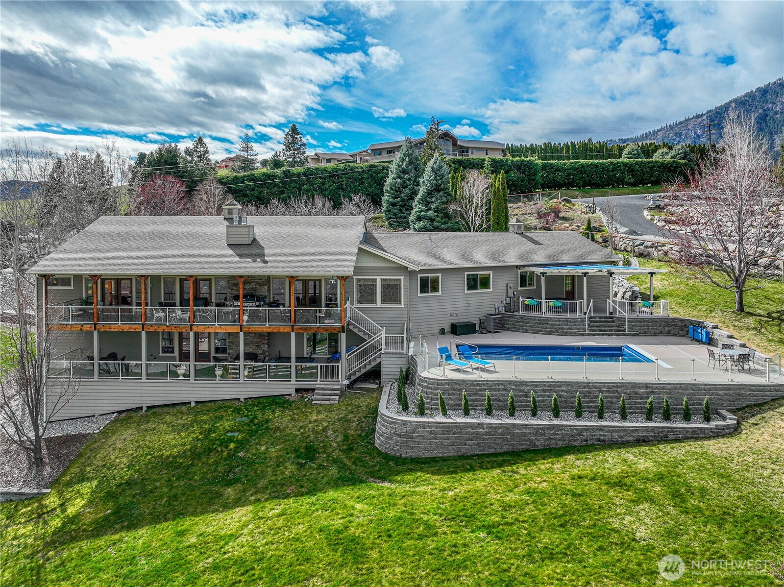 Poolside entertaining area with Lake Chelan backdrop