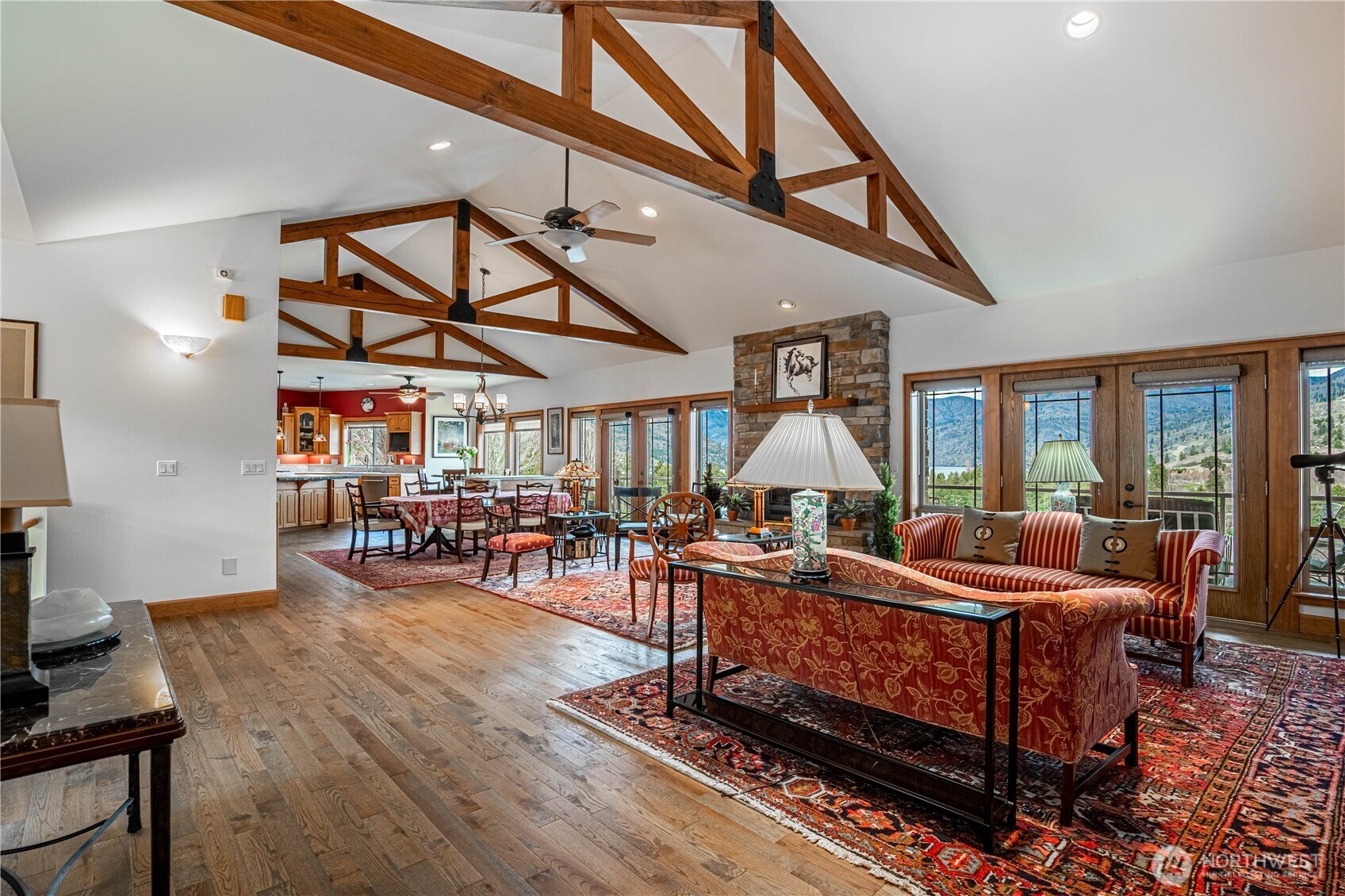 Grand great room with exposed beams and vaulted ceilings