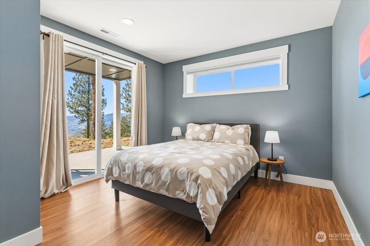 Guest bedroom with slider to access the coverd patio