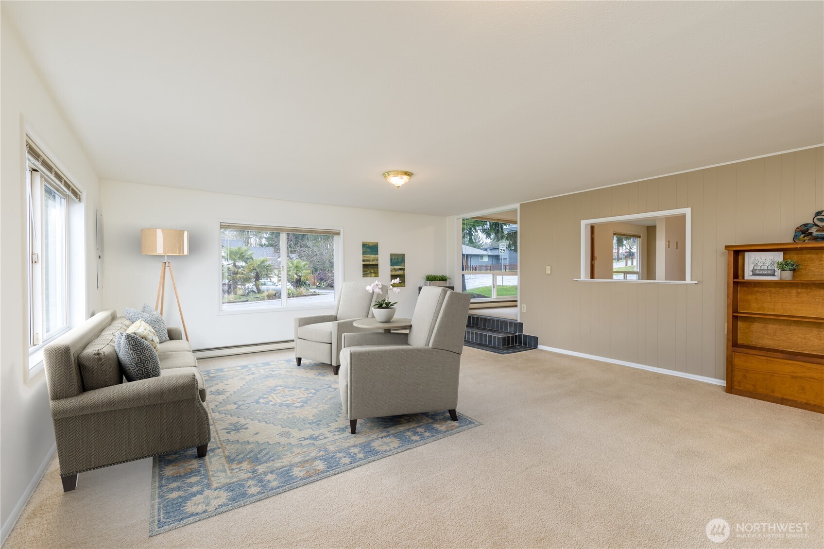 Large living room with big bright windows