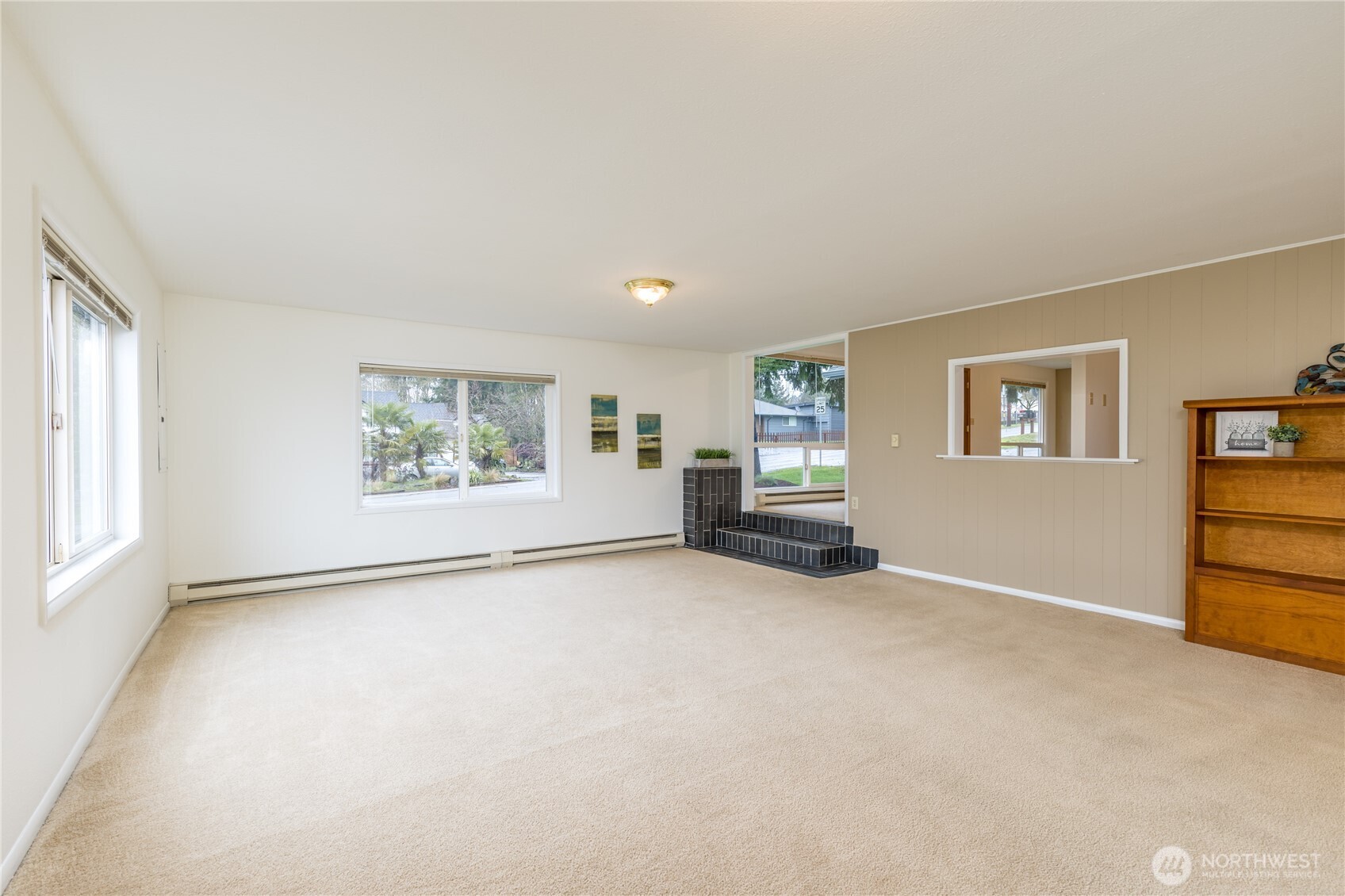 Large living room with big bright windows