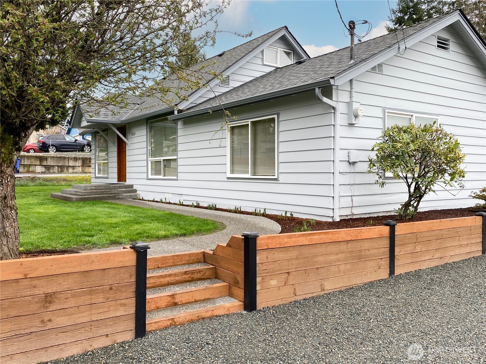 Beautiful hardscaping with brand new concrete steps, walkway and front porch