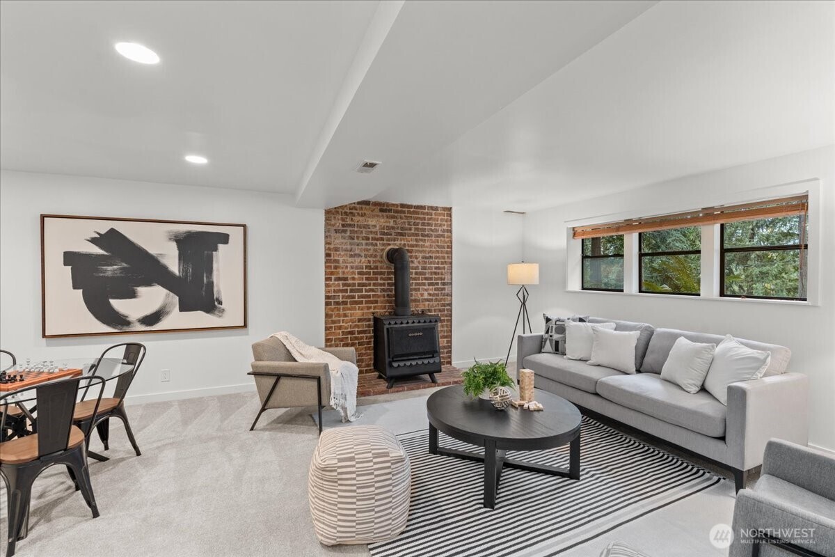 A large lower-level entertainment room perfect for movie nights, gatherings, or game days.