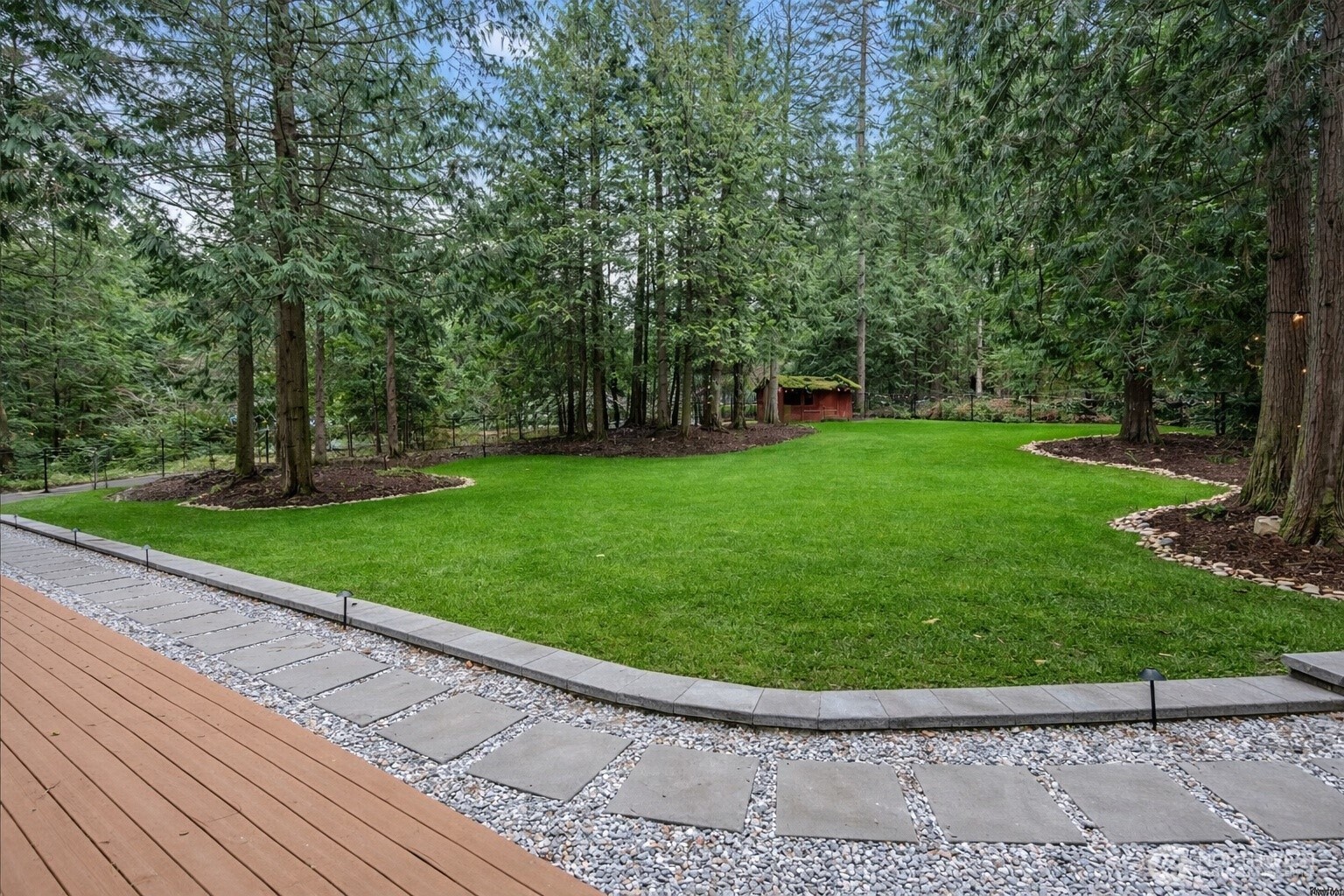 A true treasure in Mirrormont, this exceptional yard has been thoughtfully transformed into a private oasis, with the sellers investing over $30,000 in curated improvements.