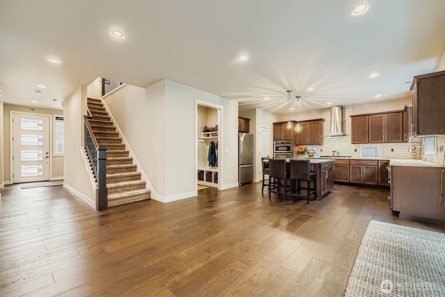 Mud room with built ins has easy access to the kitchen