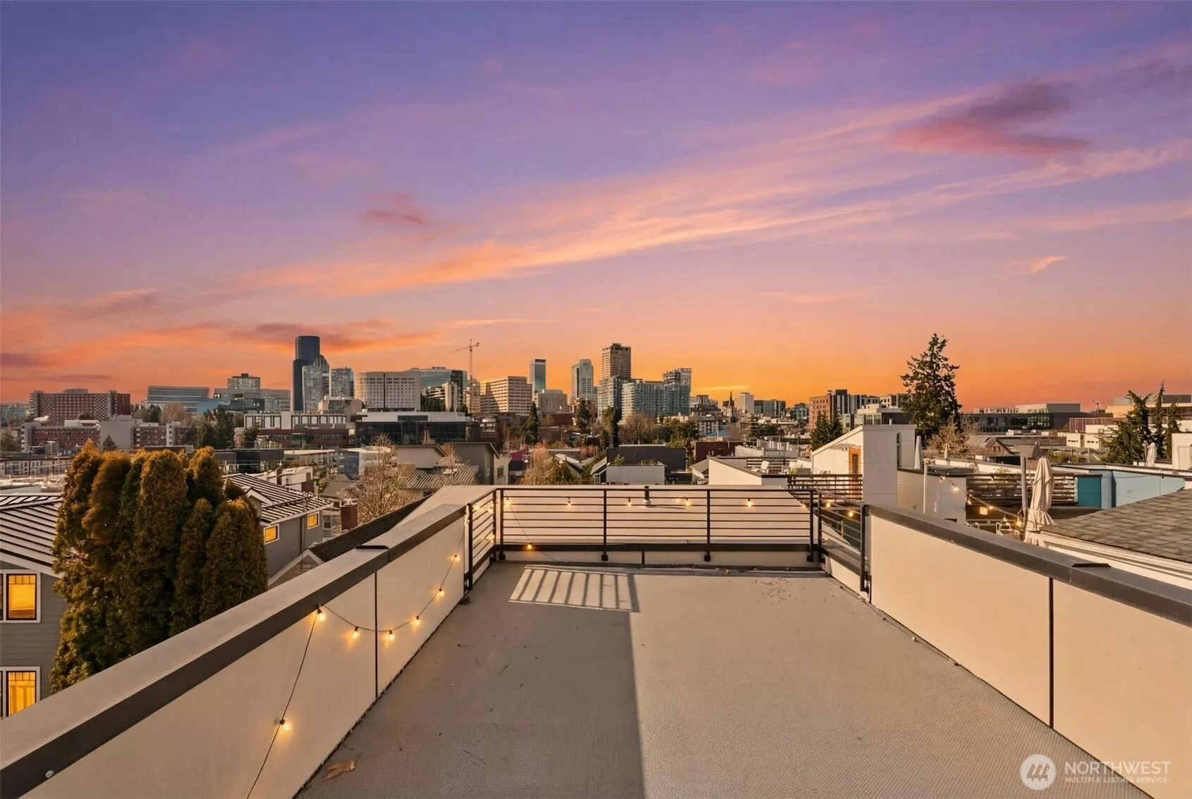 Spectacular rooftop deck captures sweeping panoramic views of the Seattle skyline