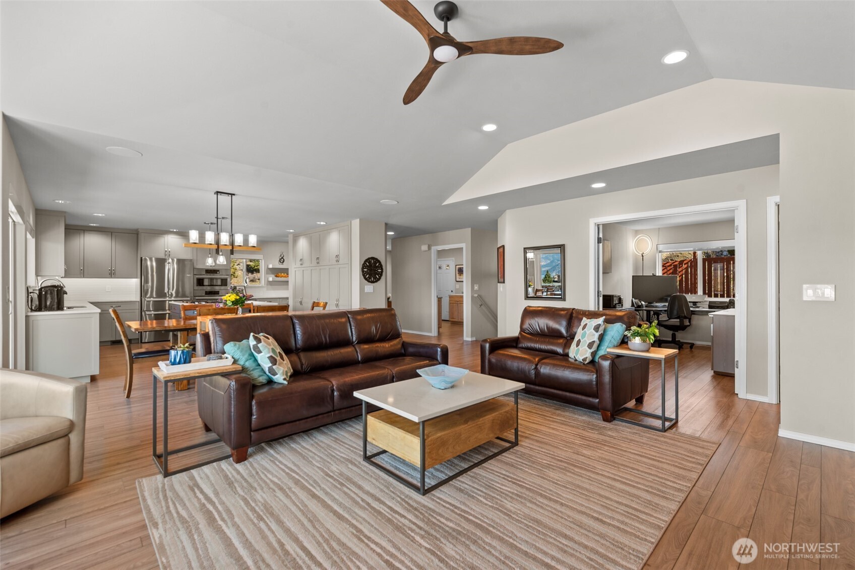 Home office opens to the great room, offering flexible space for work, living, or additional entertaining. Notice the built in speakers in the great room ceiling.