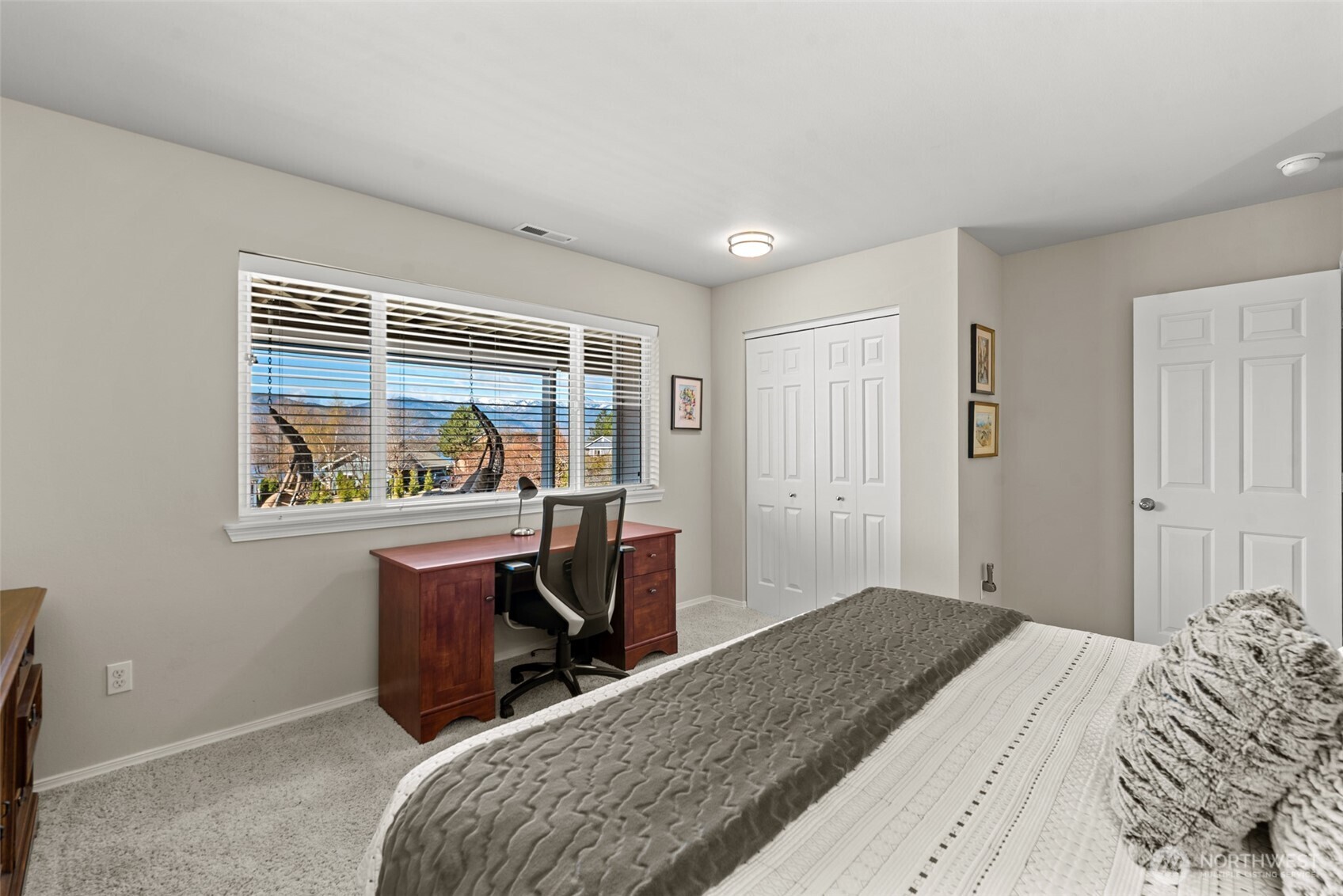 Lower-level guest bedroom #1 with Lake Chelan and mountain views in this Lake Chelan view home.