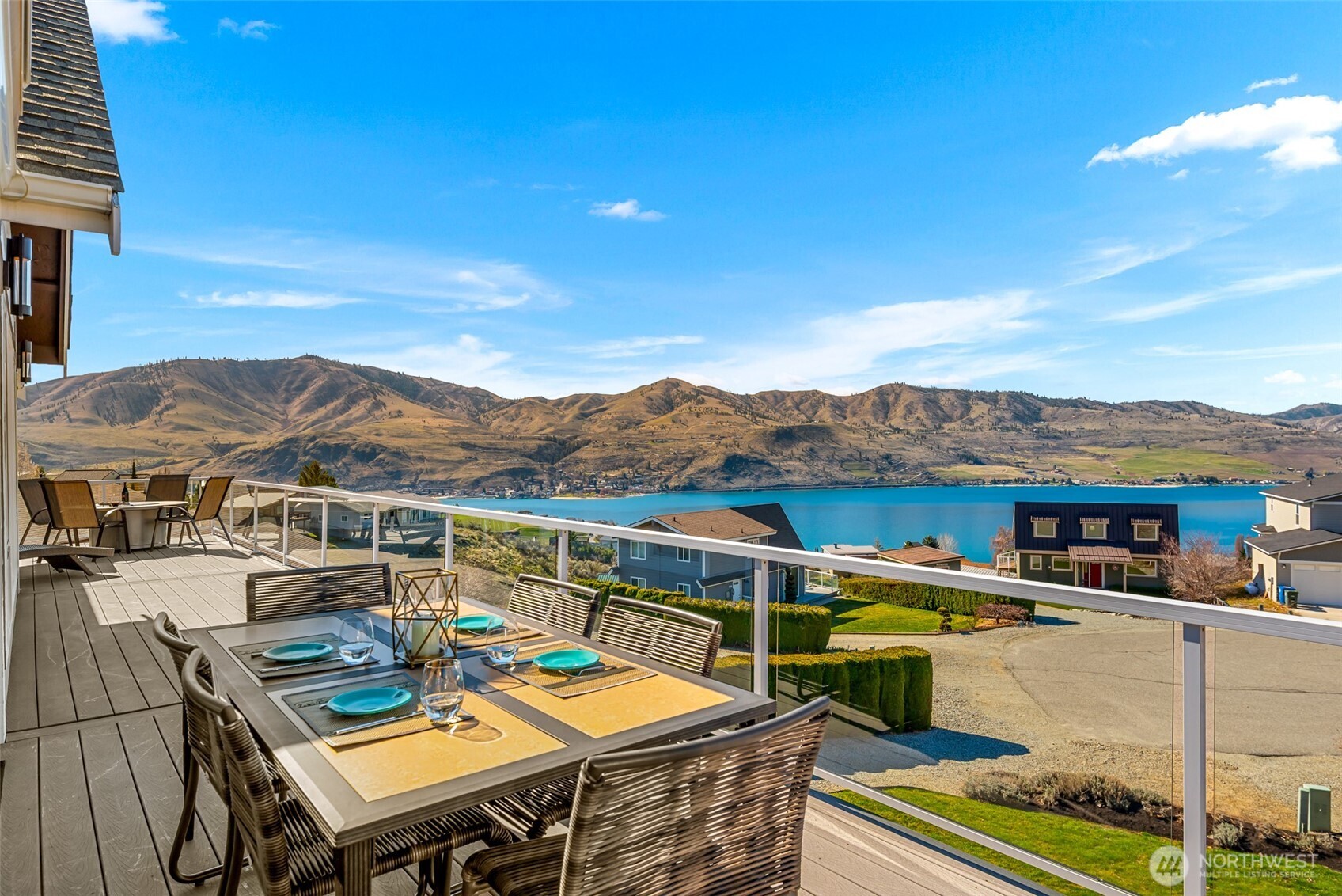 Outdoor dining with Lake Chelan views—set next to a plumbed propane BBQ and just steps from the kitchen.