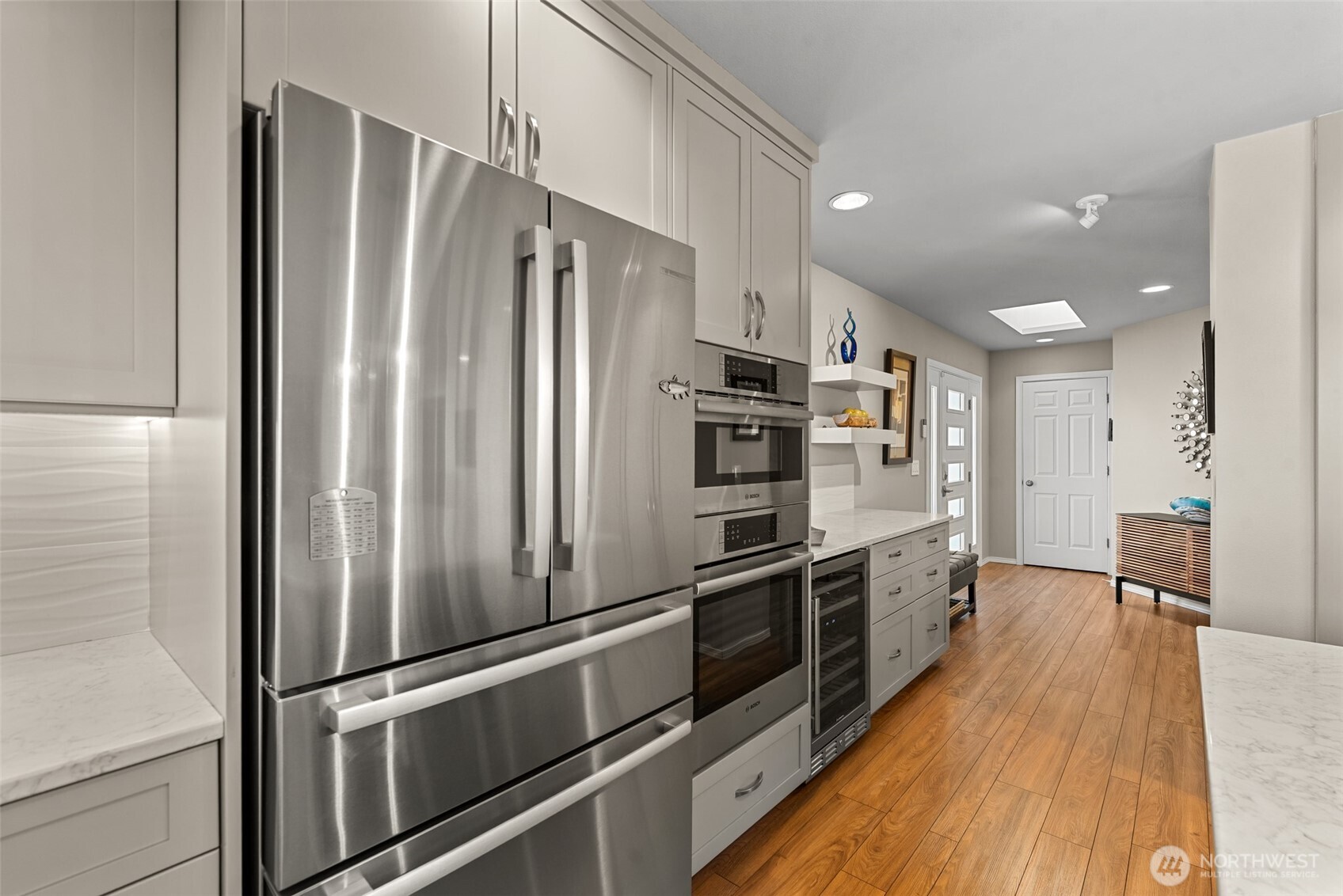 Kitchen features newer appliances, all included in the sale - even the wine fridge.