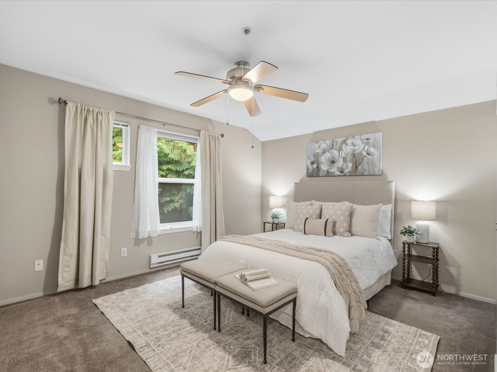 Primary bedroom featuring ensuite bath and large closet