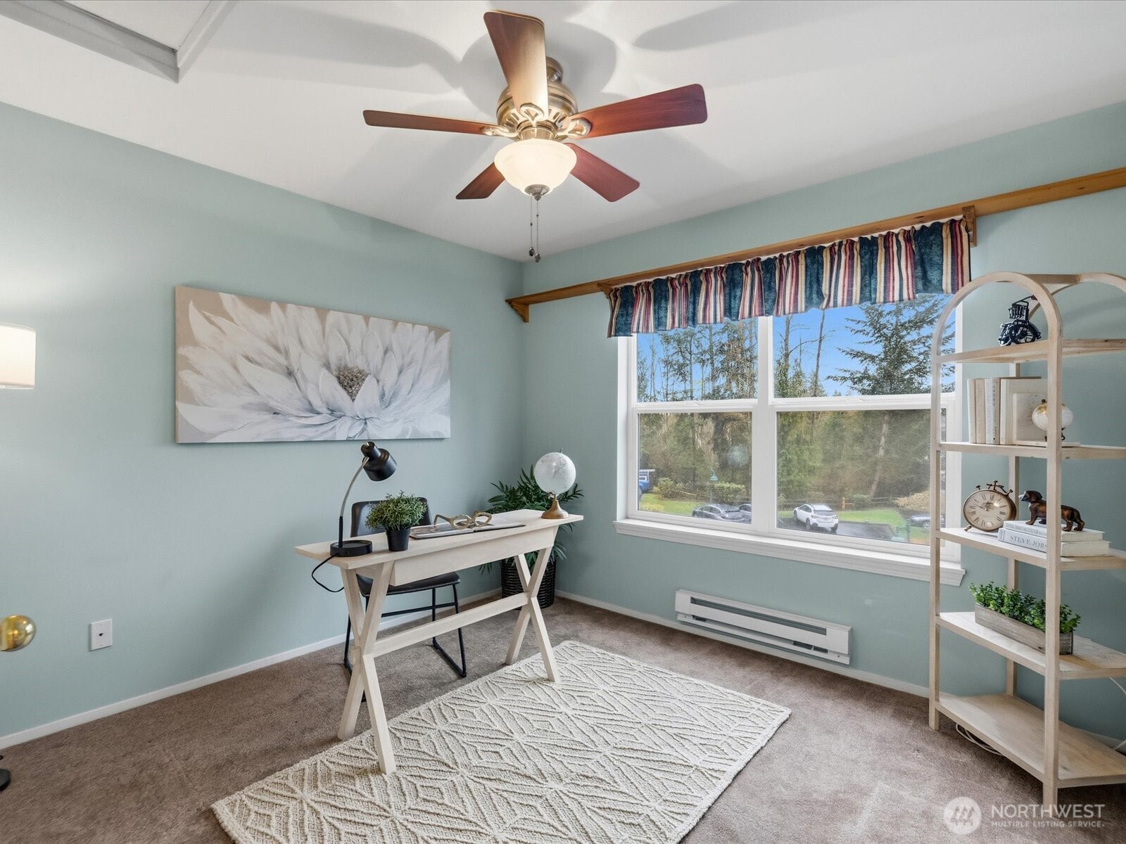 Light and bright bedroom that could also serve as a work from home office