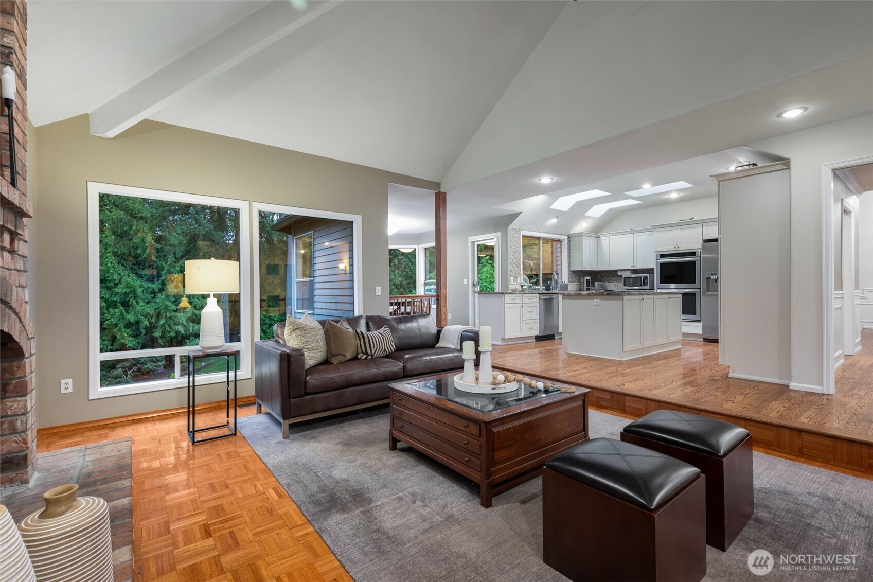 Sunken living room opens to kitchen & dining room.