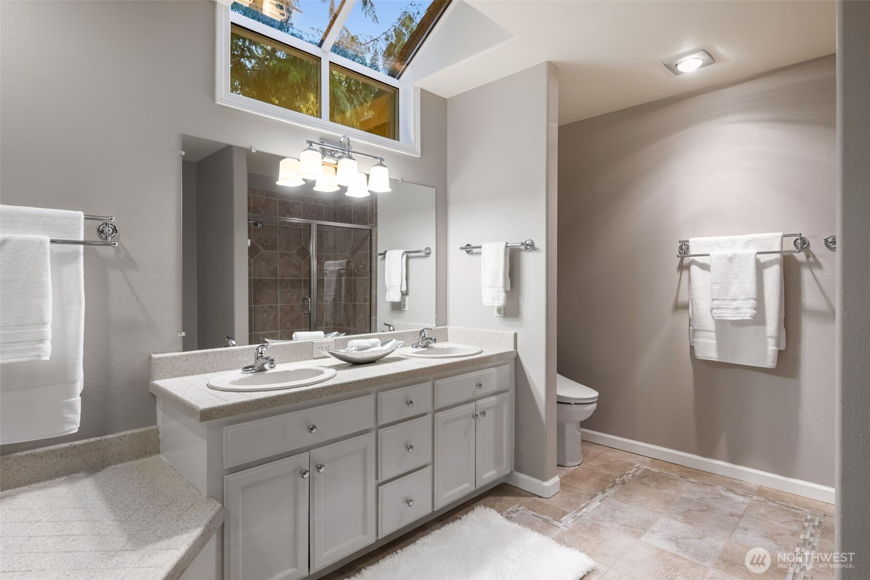 Lots of natural light in the primary bath.