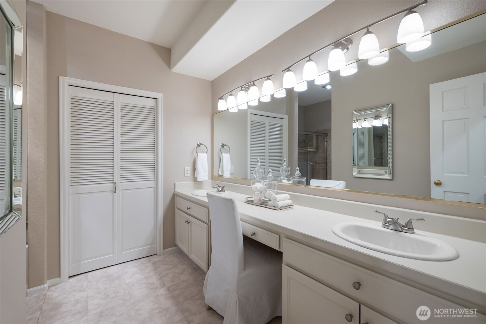 Lower level bathroom with dual vanity & plenty of storage.