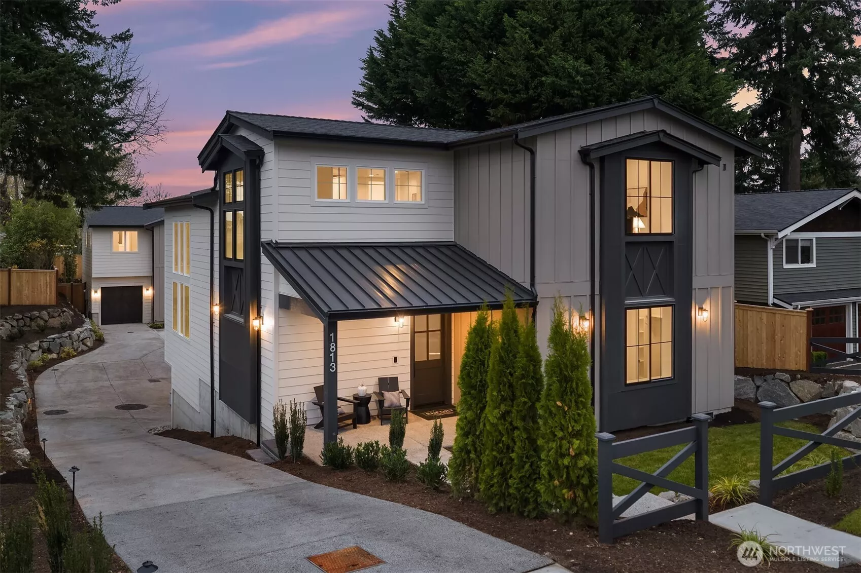 Transitional  design blending modern clean lines with timeless achiterctural elements  and a welcoming covered entry.