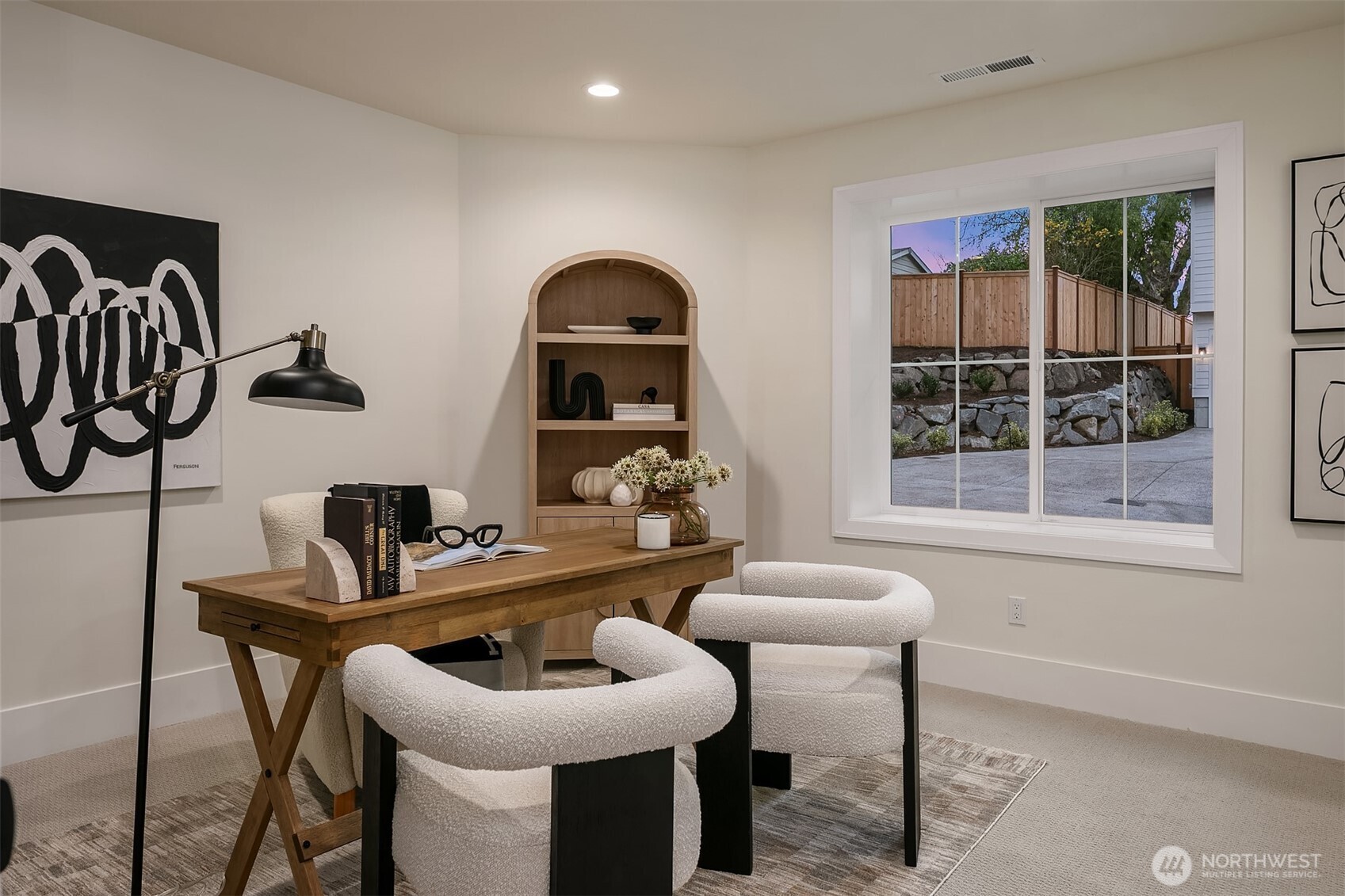 Private office on the lower level provides a versatile room perfect for remote work, studying, or a peaceful retreat.