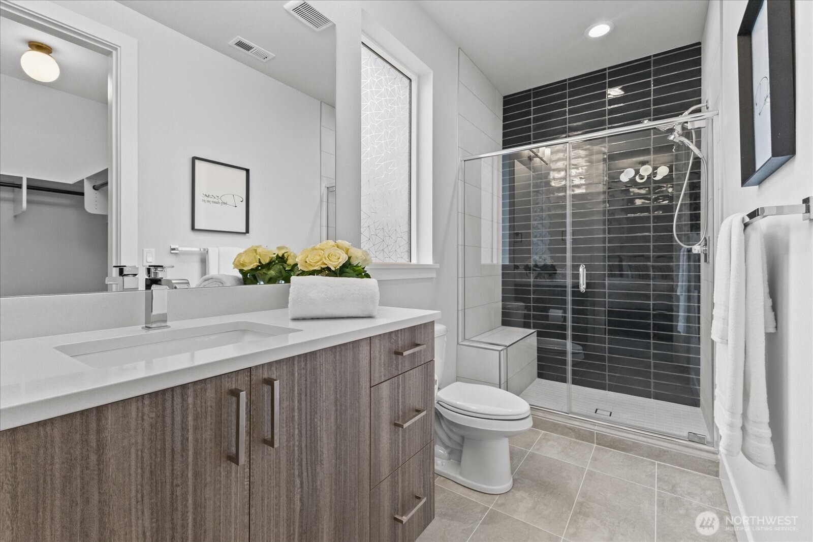Clean-lined and beautifully finished, the guest bath pairs modern design with everyday ease, creating a space that feels fresh, refined, and inviting.