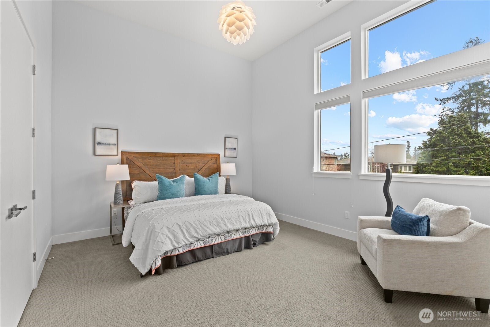 Upstairs Bedroom 1 - Filled with natural light and soaring volume, this upstairs ensuite bedroom offers an airy, peaceful retreat with the comfort of its own private bath.