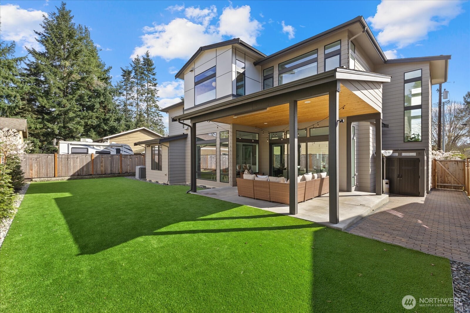 With its striking architectural profile, manicured approach, and modern curb appeal, this residence makes an unforgettable statement from the moment you arrive.