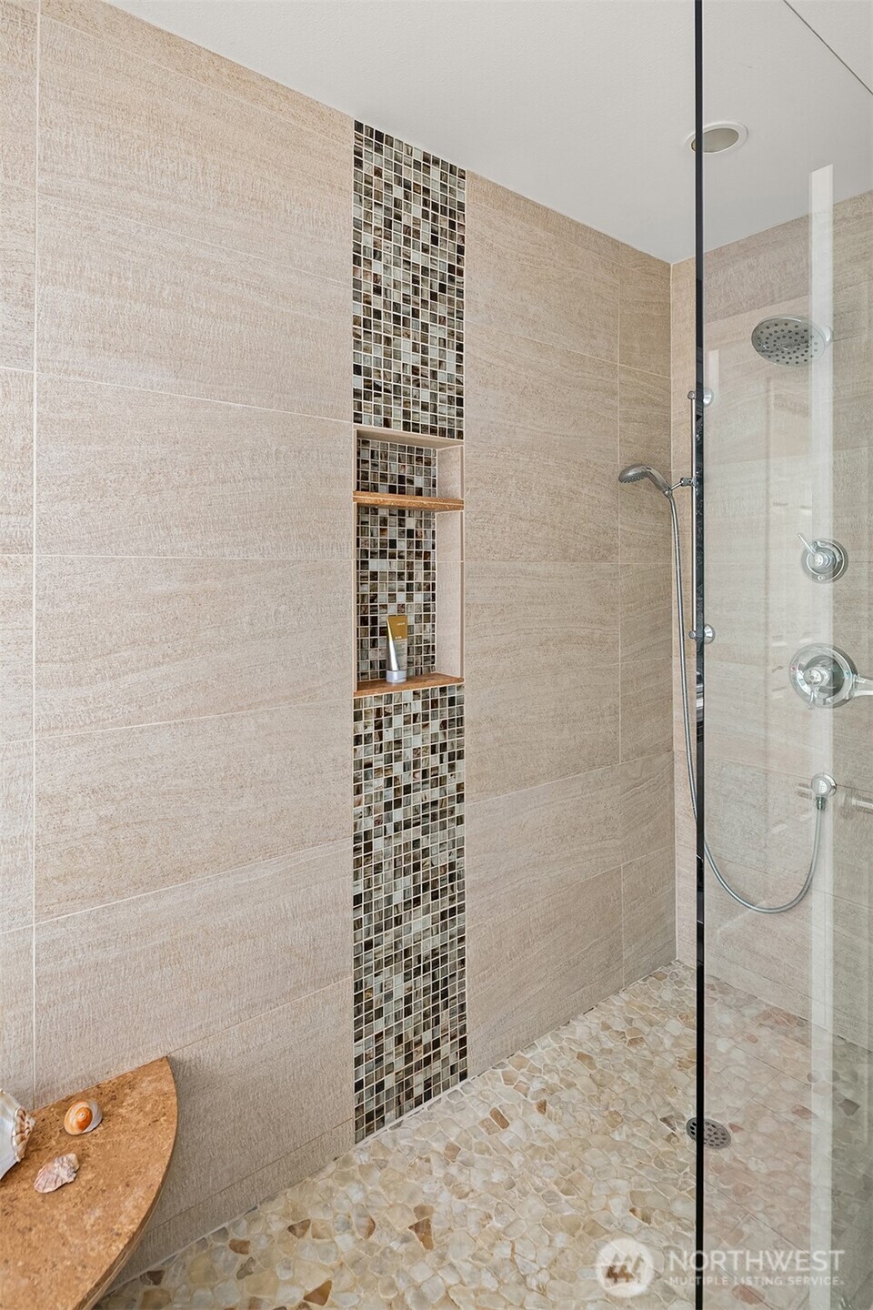 One of 2 vanities in the primary suite. To the left is the door to walk-in closet with custom shelving