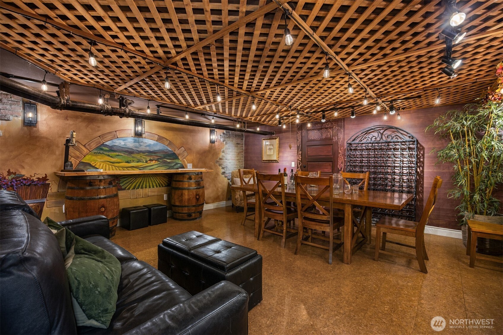 A hidden speakeasy-inspired lower level sets the stage for unforgettable evenings. Warm wood tones, lattice ceiling detail, ambient lighting, and a cozy fireplace create an intimate wine-tasting and entertaining space unlike anything else in downtown Snohomish.
