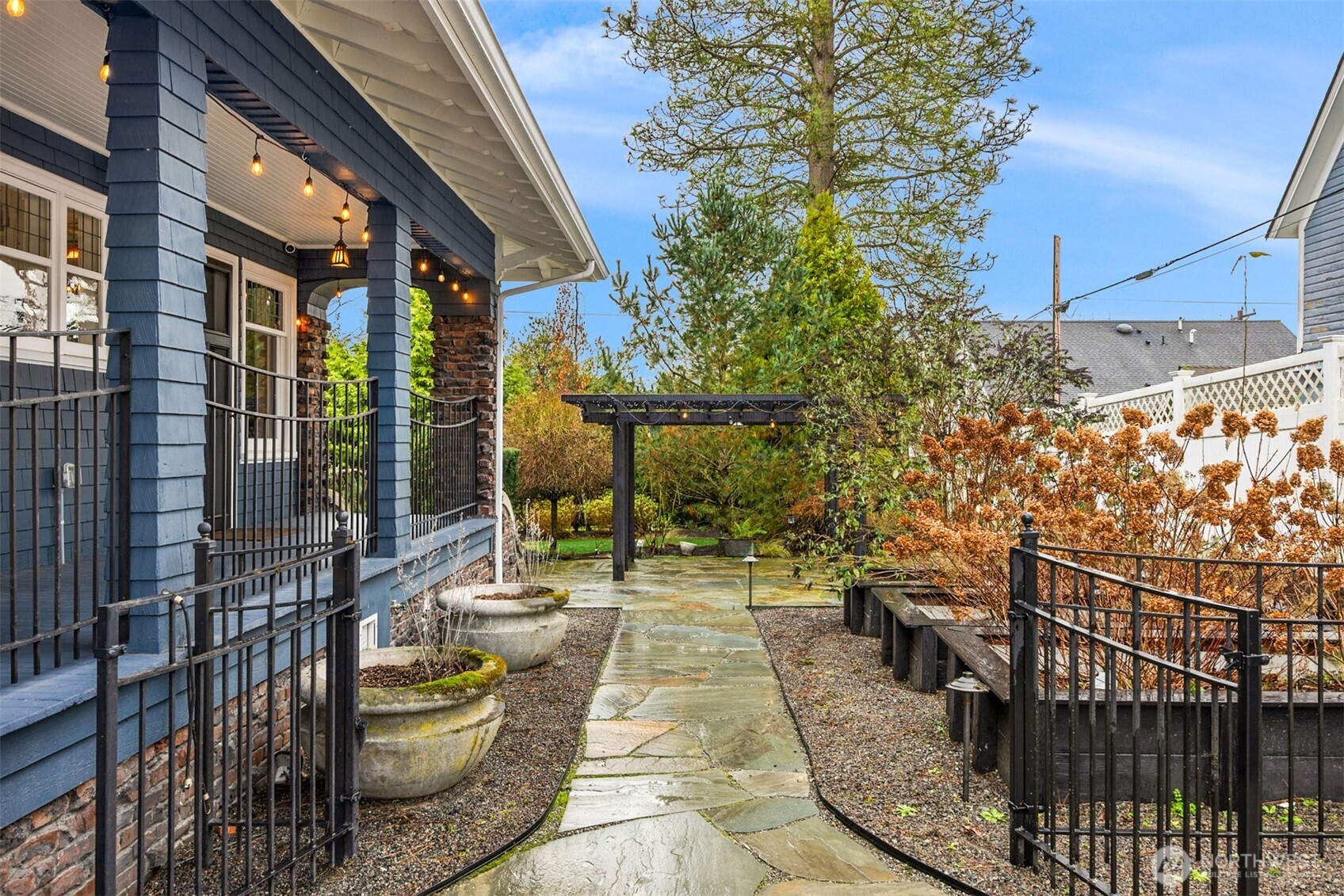 Stone pathways lead through thoughtfully designed garden areas, reinforcing the sense of intention and care woven throughout the property.