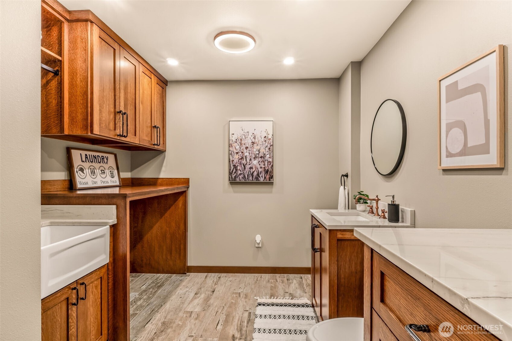 Laundry room is downstairs and has an all new half bath with a utility sink.  Lots of storage as well.