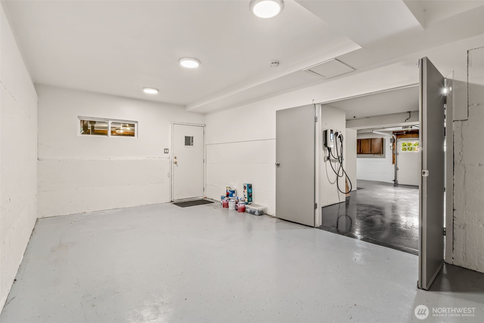 XL garage w/ EV charger and this extra BONUS room that has so many uses!