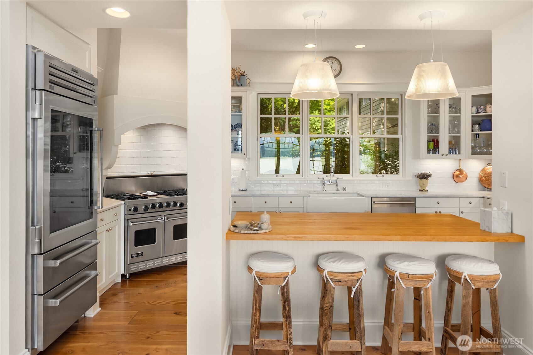 Stainless appliances including 36" Sub-Zero PRO-series refrigerator.