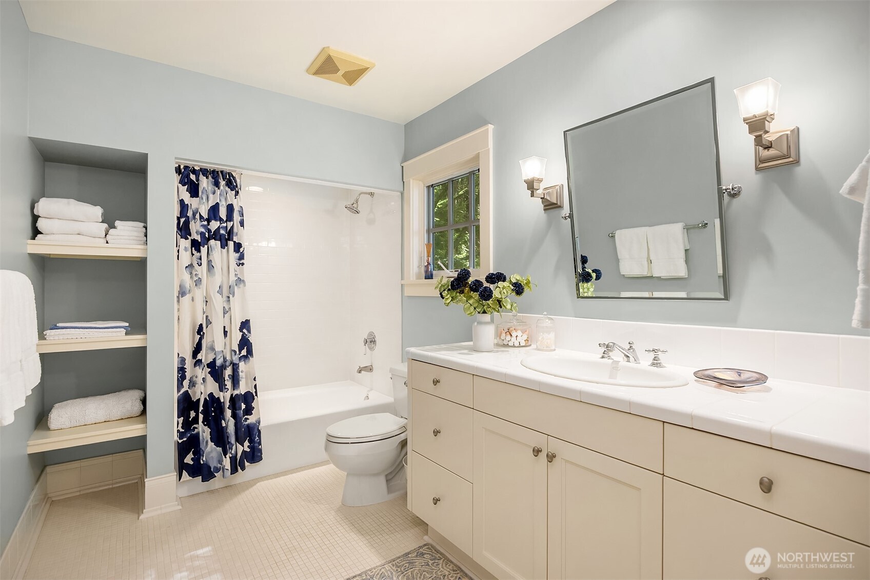 Full bathroom for guests. Just outside in the hall is the laundry chute.