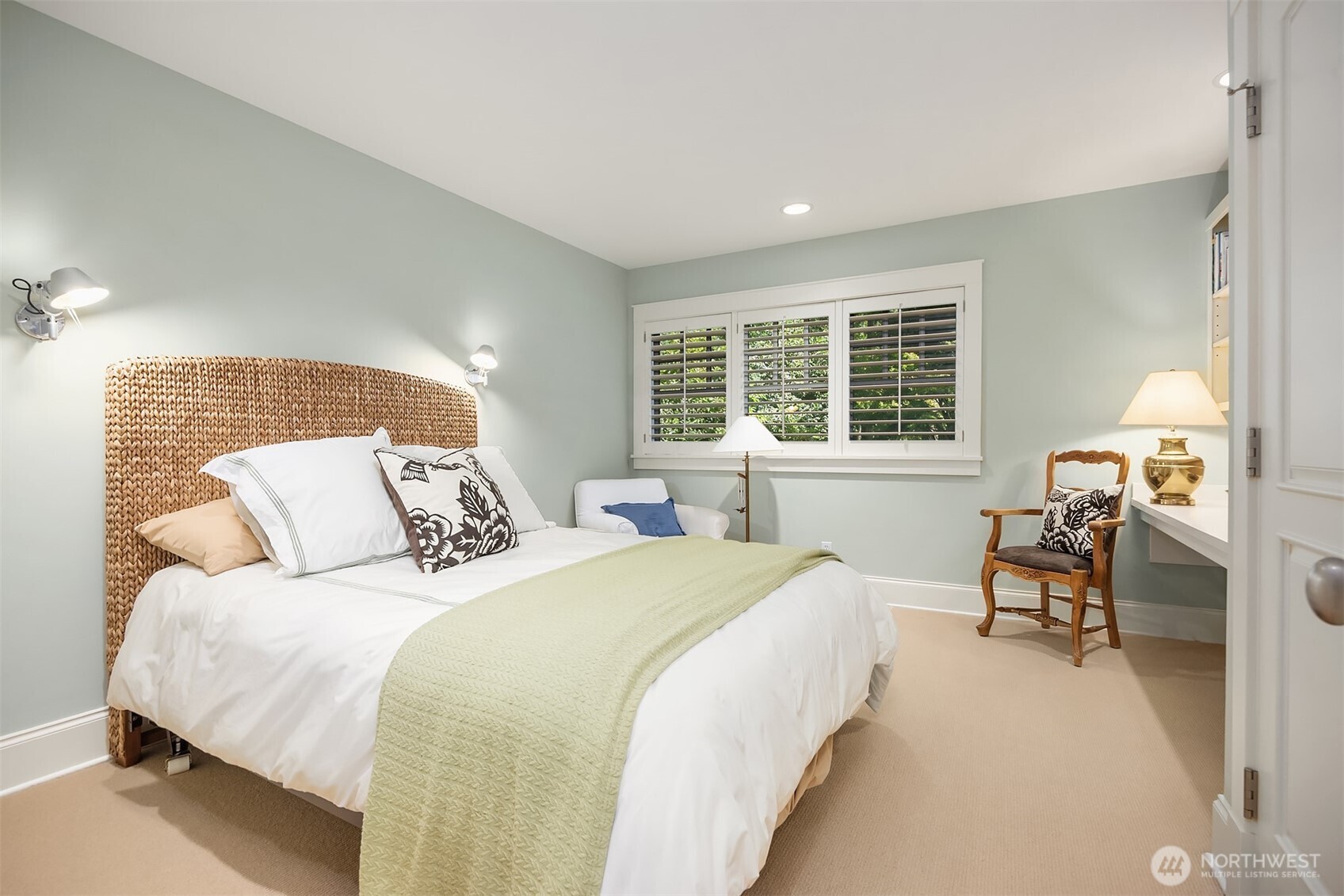 Another bedroom with built in desk and storage.
