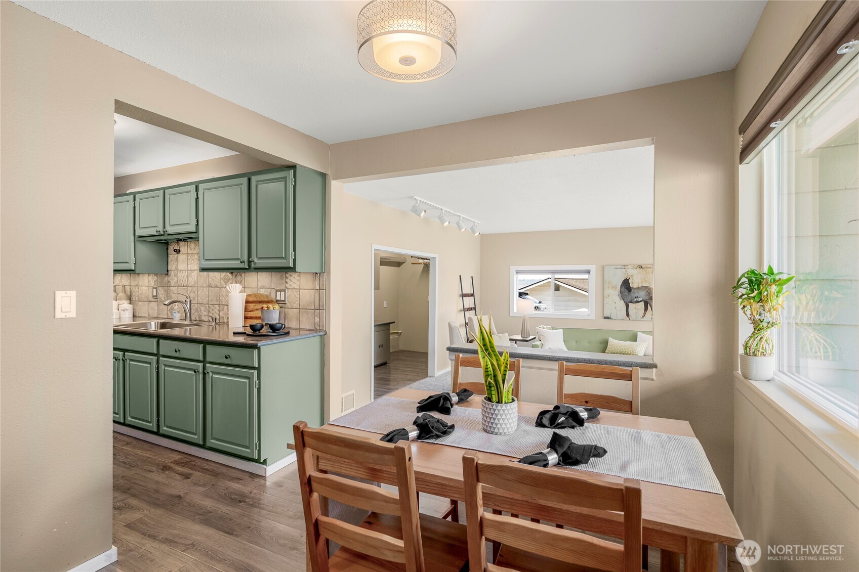 Dining space looking towards family room and kitchen